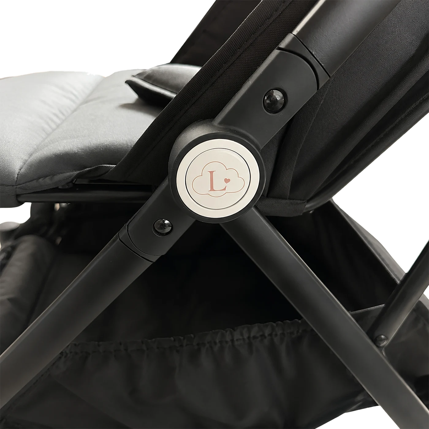 Close-up of the Amélie's folding hinge with the enamelled Lunelle cloud badge, in black.