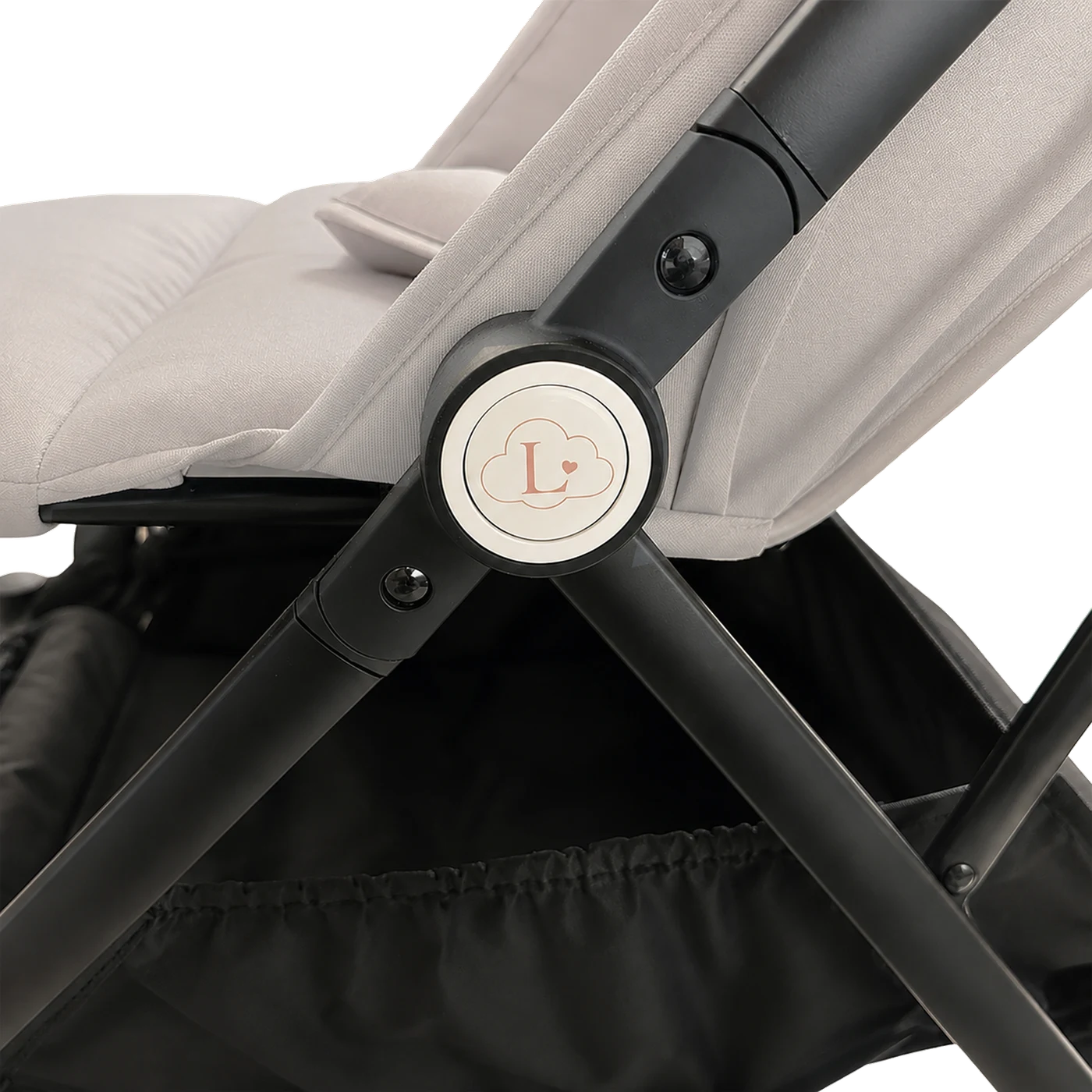 Close-up of the Amélie's folding hinge with the enamelled Lunelle cloud badge, in cream.